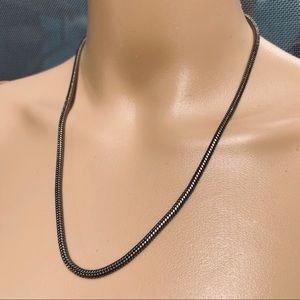 18-20 inch serpentine silver colored necklace.